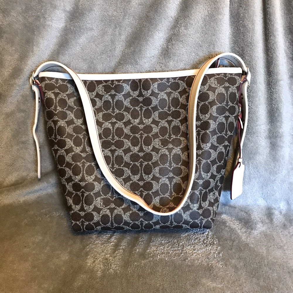Large brown Coach purse.Great condition but small red mark on handle.